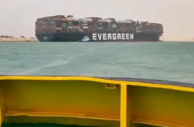 Container ship runs aground in Suez Canal causing traffic jam