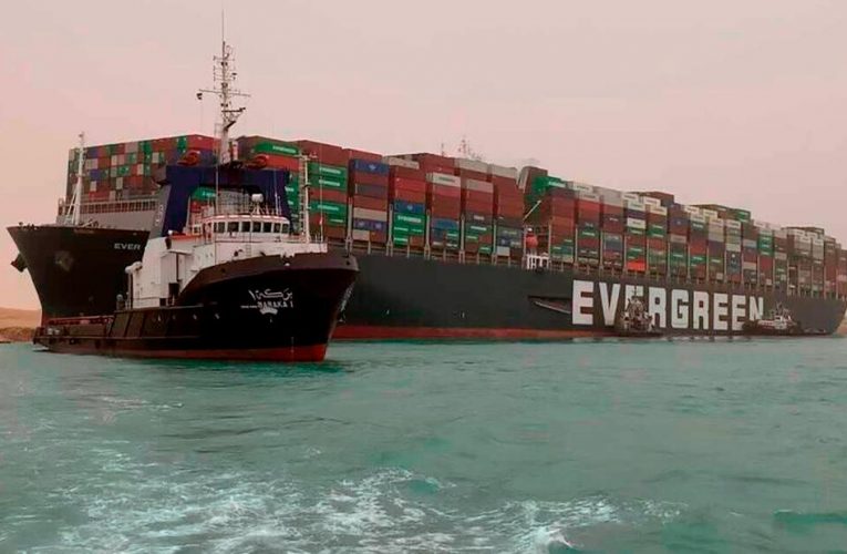 Tugs resume effort to clear Suez Canal ship blockage as traffic jam builds