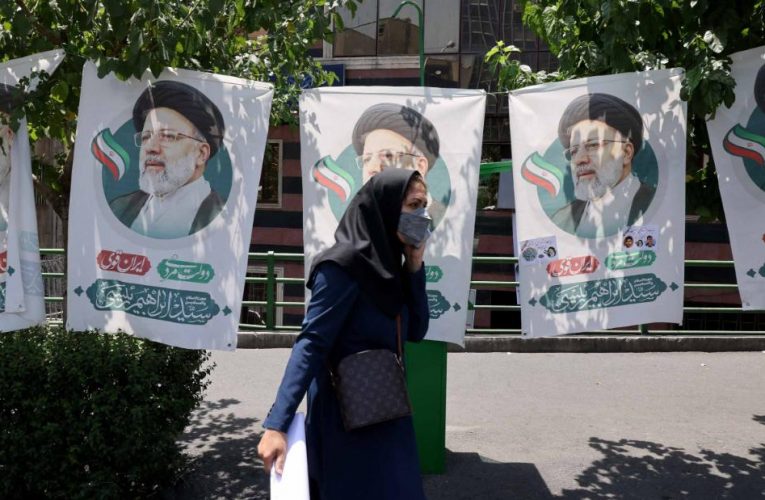 Iranians vote in an all but decided presidential election