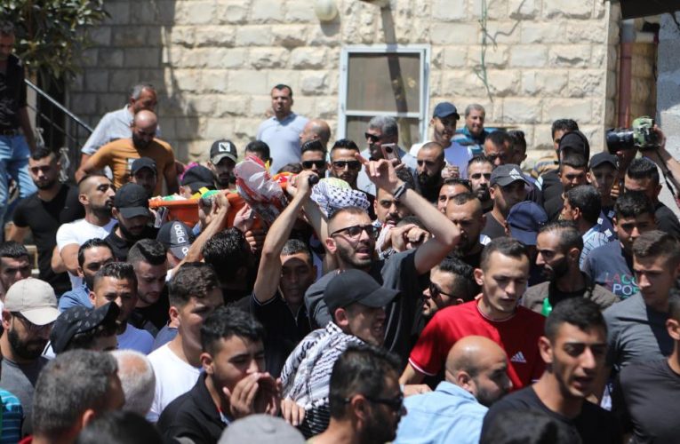 Palestinian shot dead in violent clashes as 12-year old, also killed by Israeli soldiers, is buried