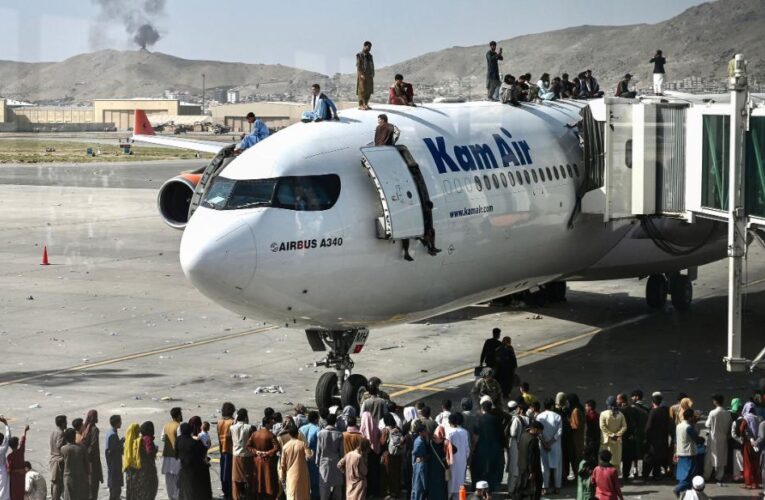 Chaos in Kabul as Taliban take power and thousands try to flee
