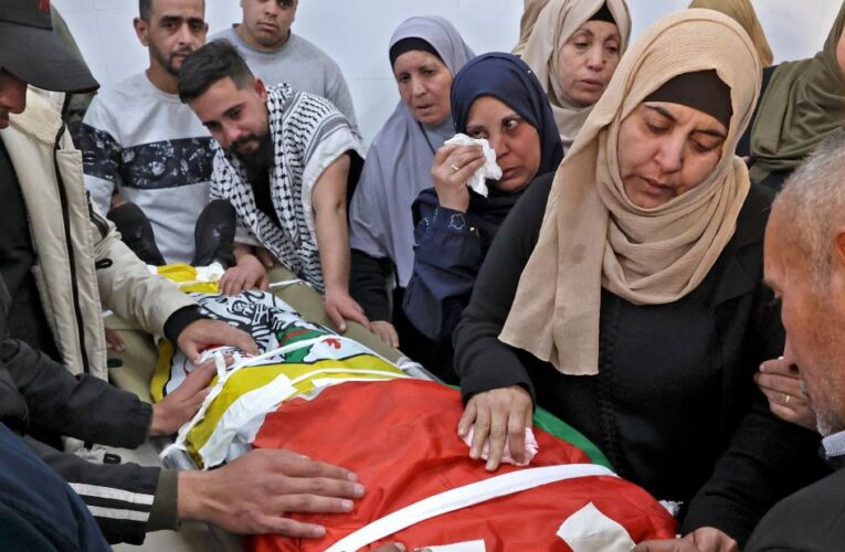 Hundreds mourn Palestinian boy killed by Israeli forces as both sides report violence across the West Bank