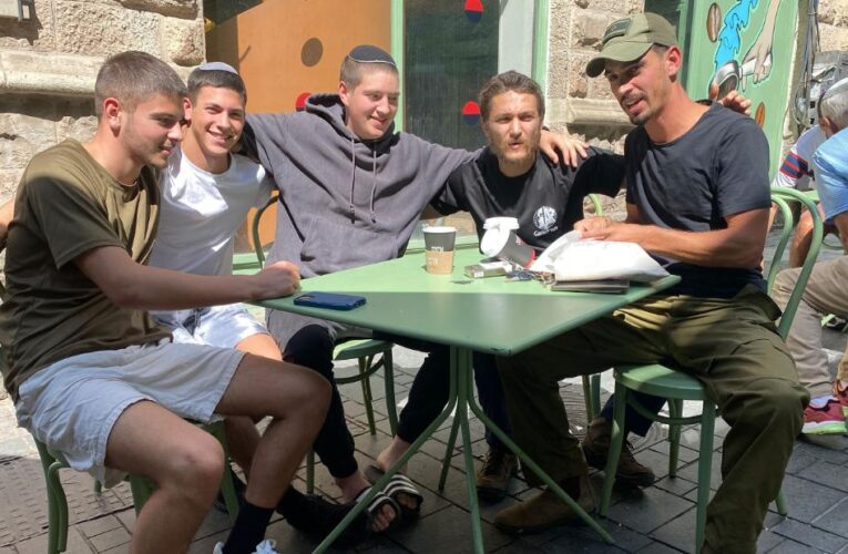 Deeply divided for years, Israelis brace for war and try to put their differences aside